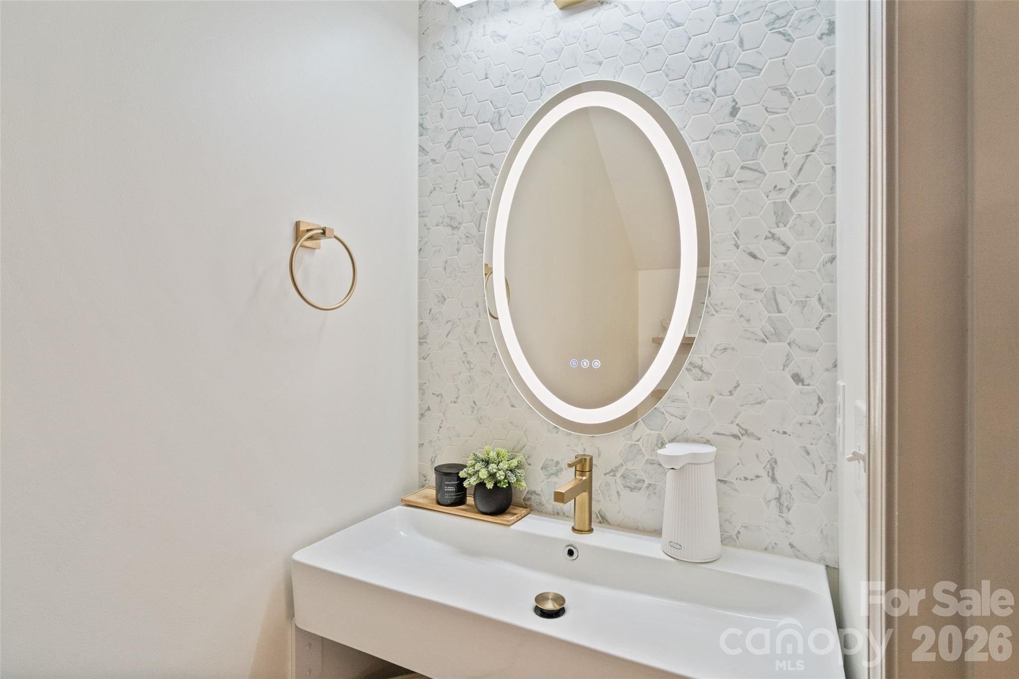 8726 Conrad Street Locust, NC 28097 - Photo 14 of 36 a bathroom with a sink mirror and vanity