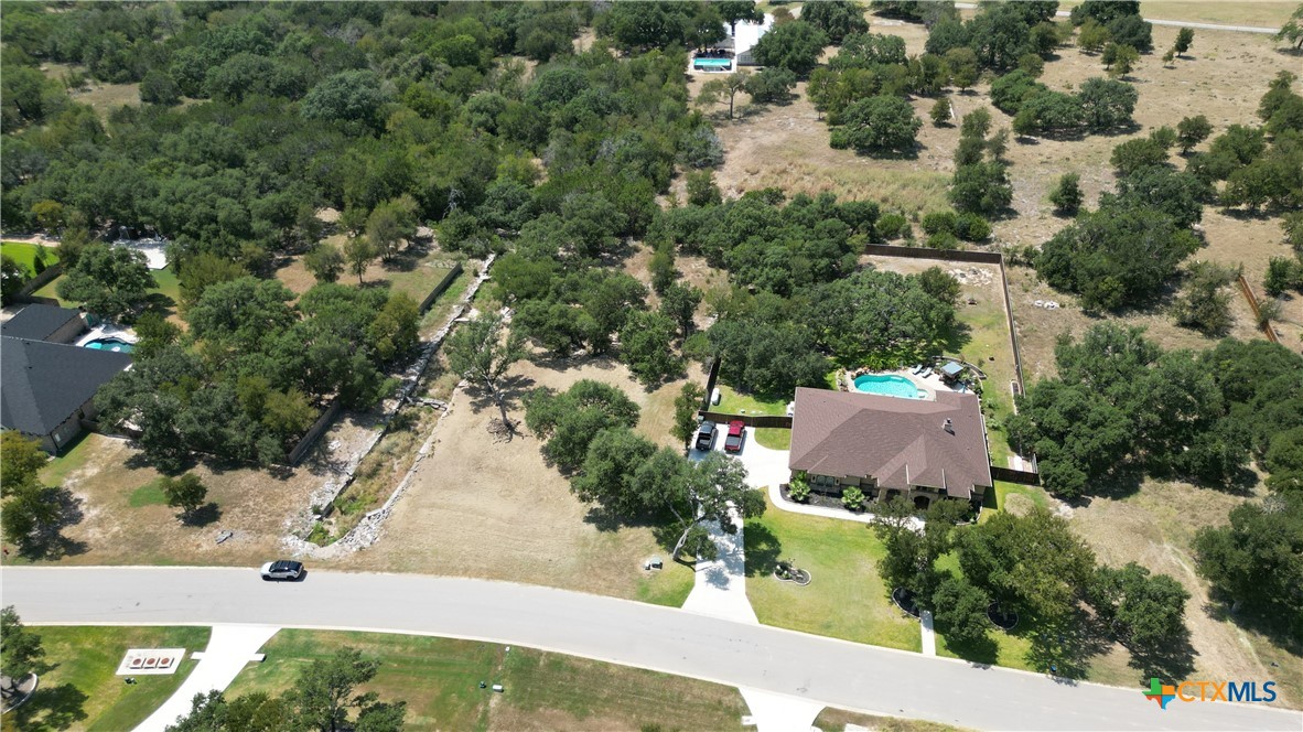 8378 Spring Creek Loop Salado, TX 76571 - Photo 9 of 12 an aerial view of residential houses with outdoor space and trees