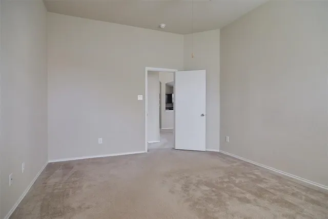 a bathroom with a tub a double vanity sink and mirror