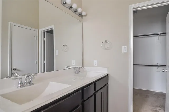 a white bath tub sitting next to a window