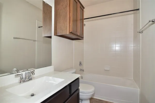 a view of an empty room with a cabinet