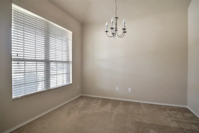 an empty room with a hallway