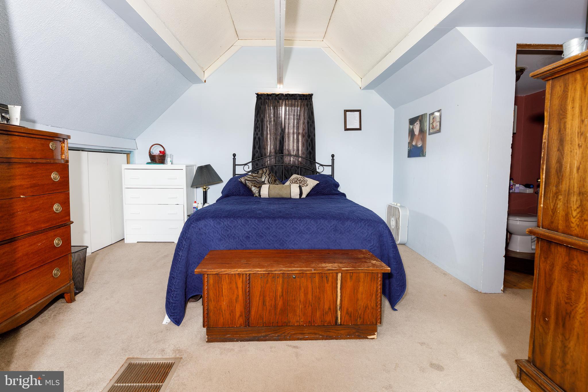 706 Camp Road Denton, MD 21629 - Photo 13 of 20 a bed room with a bed and a window