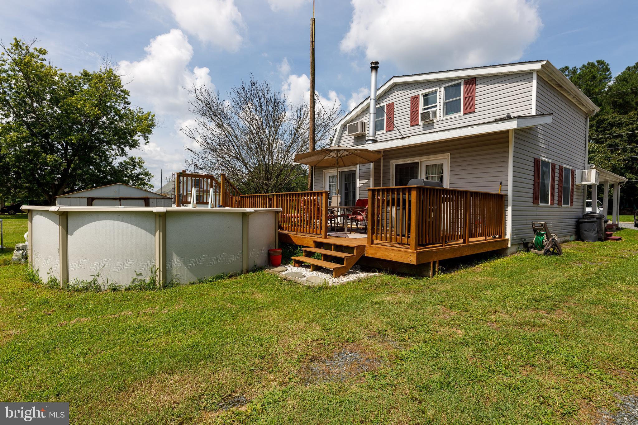 706 Camp Road Denton, MD 21629 - Photo 3 of 20 a view of a house with a yard