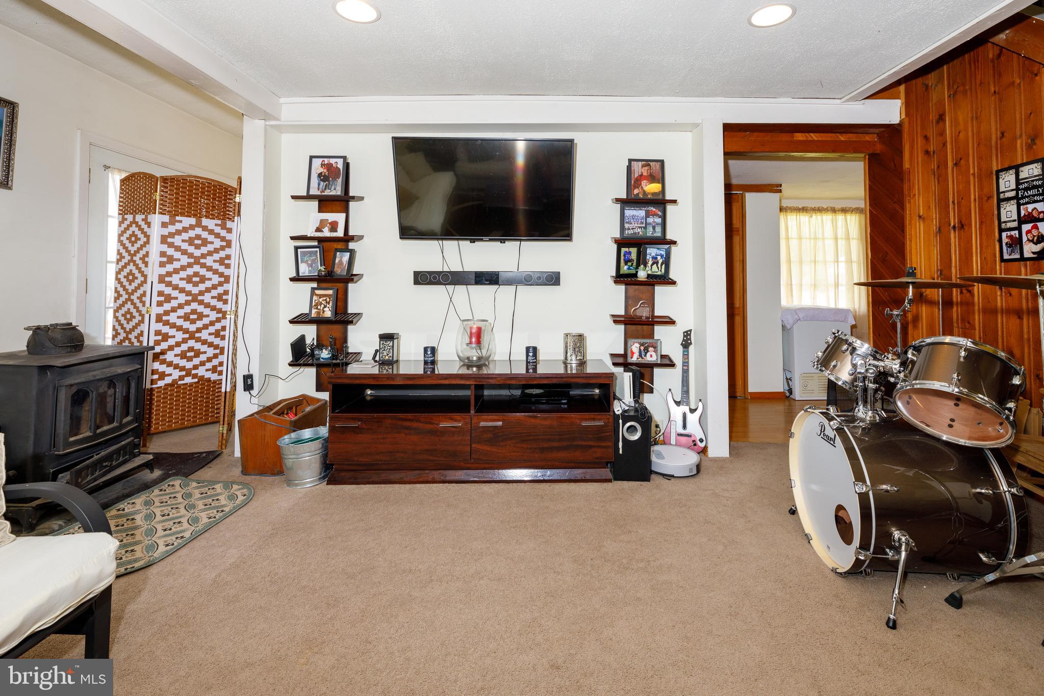 706 Camp Road Denton, MD 21629 - Photo 10 of 20 a room with furniture and a flat screen tv