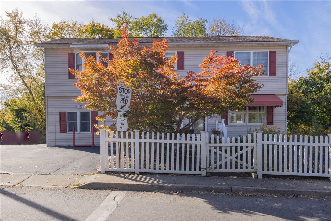 16 Lawrence Street Spring Valley, NY 10977 - Photo 1 of 1 a front view of a house with a garden