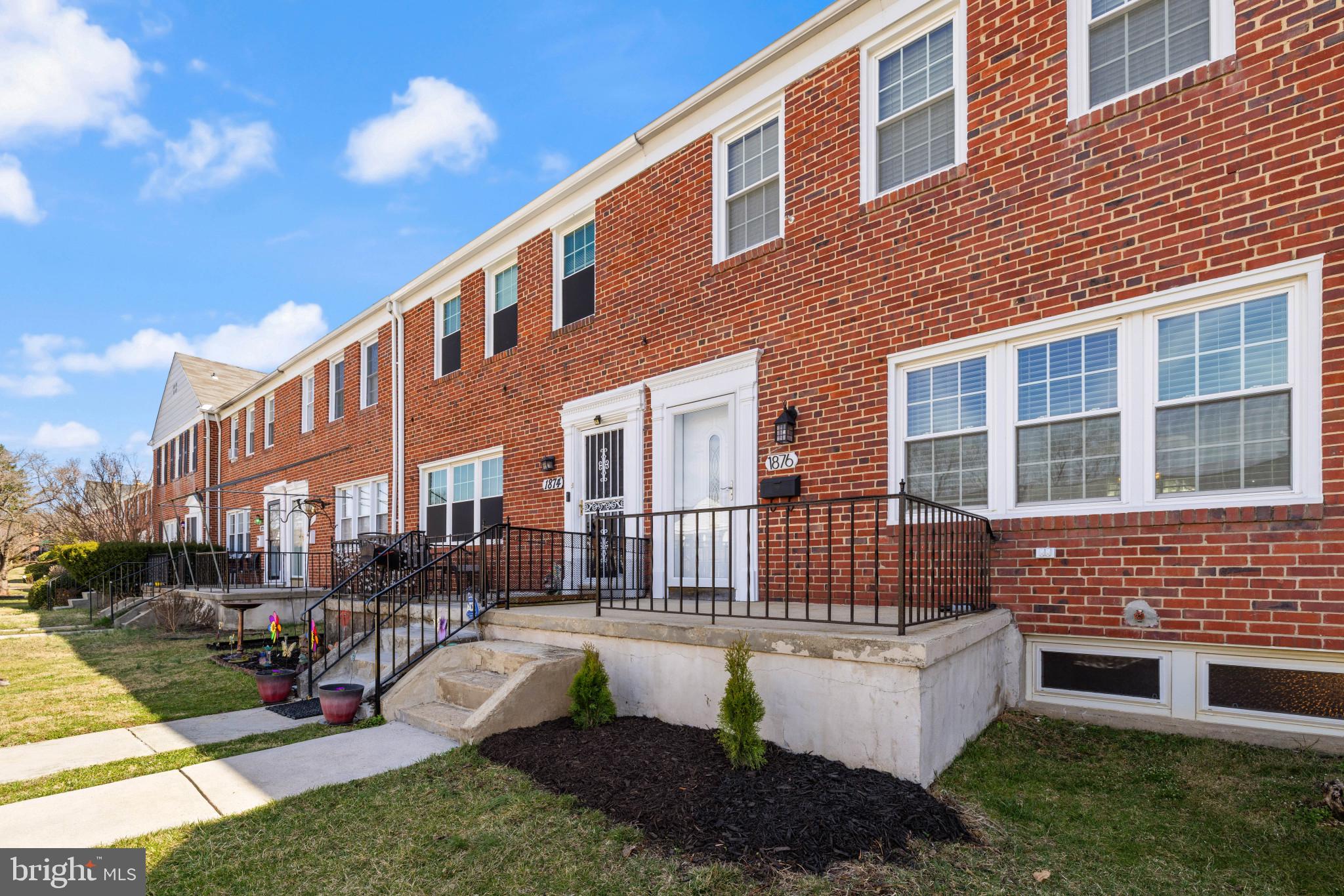 1876 Edgewood Road Towson, MD 21286 - Photo 1 of 32 a front view of a building with garden and patio