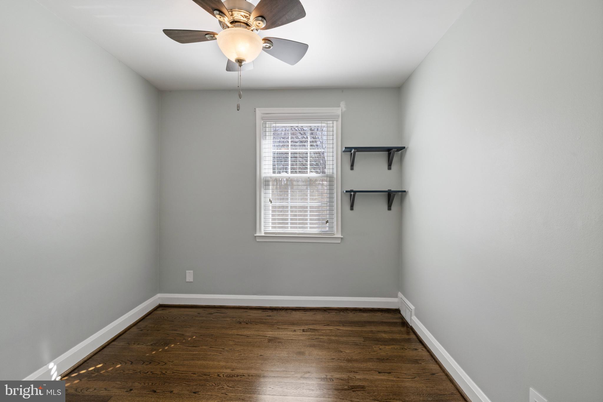 1876 Edgewood Road Towson, MD 21286 - Photo 14 of 32 wooden floor in an empty room with a window
