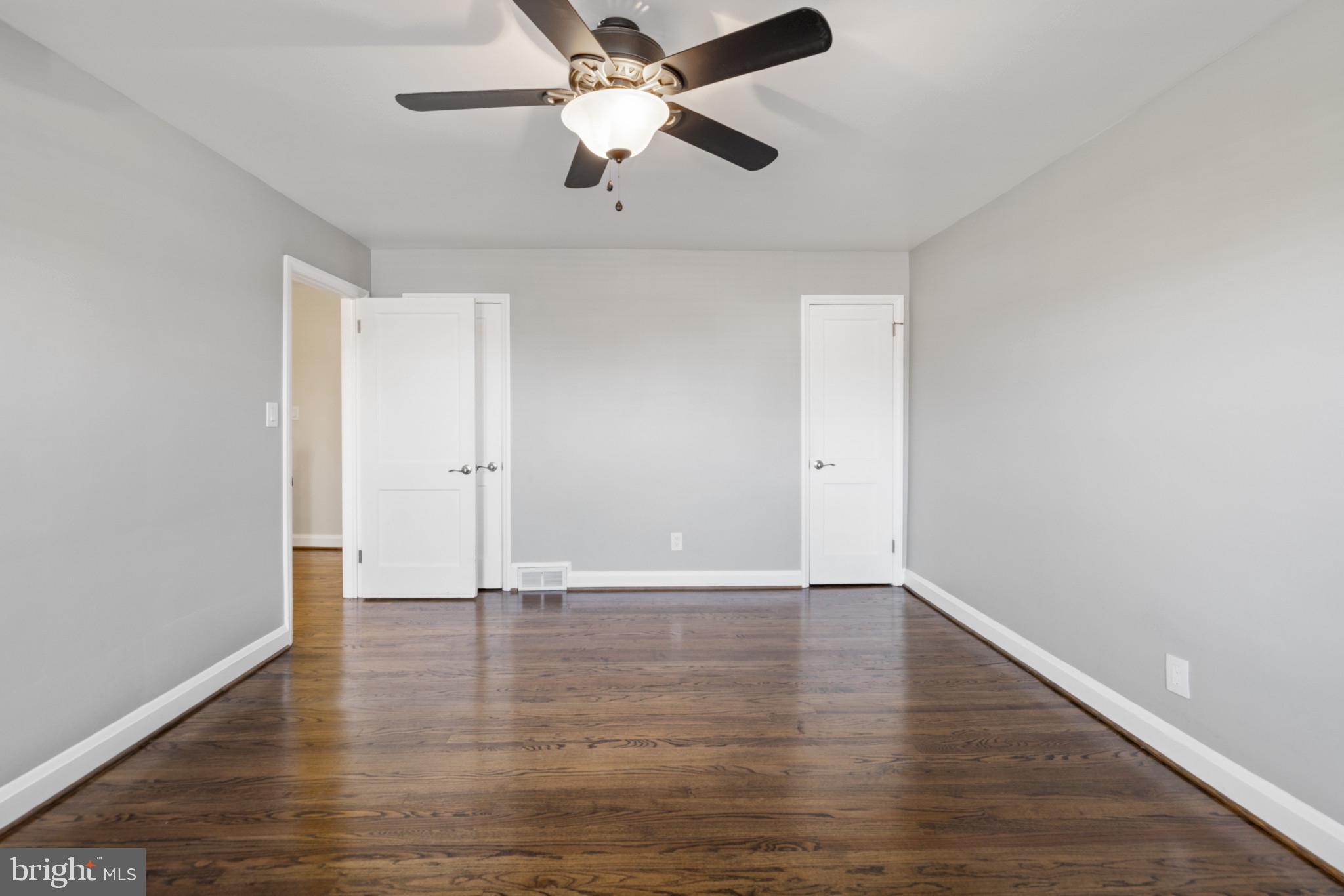 1876 Edgewood Road Towson, MD 21286 - Photo 17 of 32 an empty room with wooden floor ceiling fan and window