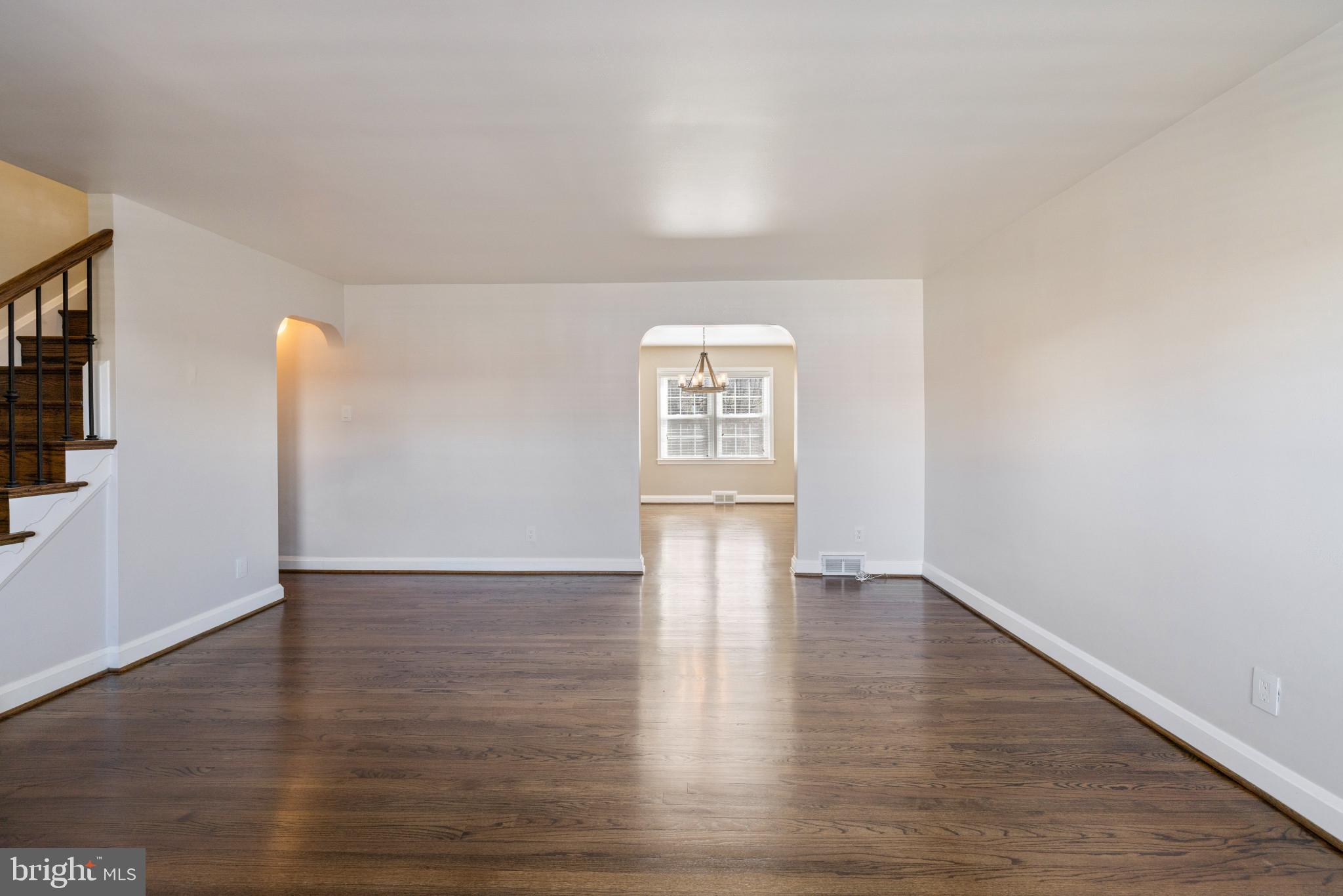 1876 Edgewood Road Towson, MD 21286 - Photo 5 of 32 a view of an empty room with a window and wooden floor