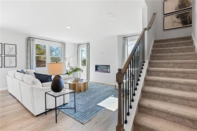 a living room with furniture and a table