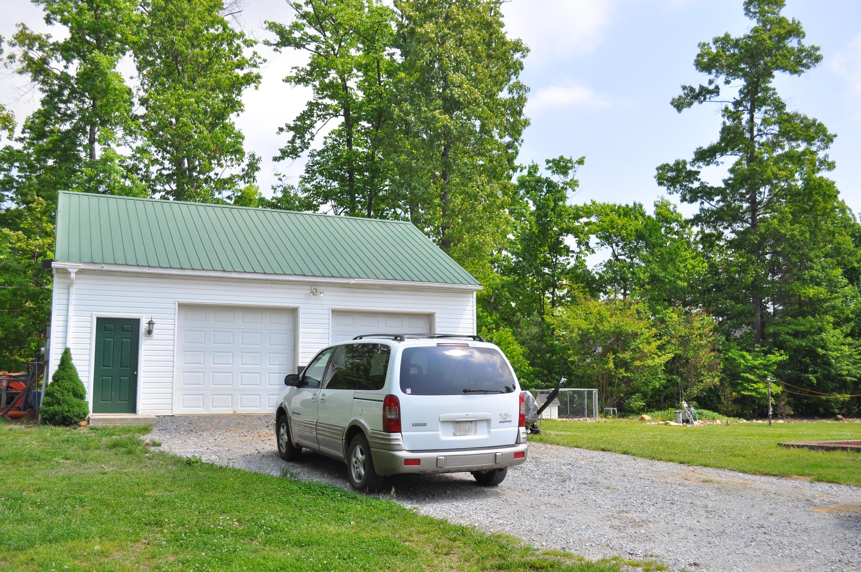 720 Leonard Farm Road Blue Ridge, VA 24064 - Photo 22 of 27 a house view with a garden space