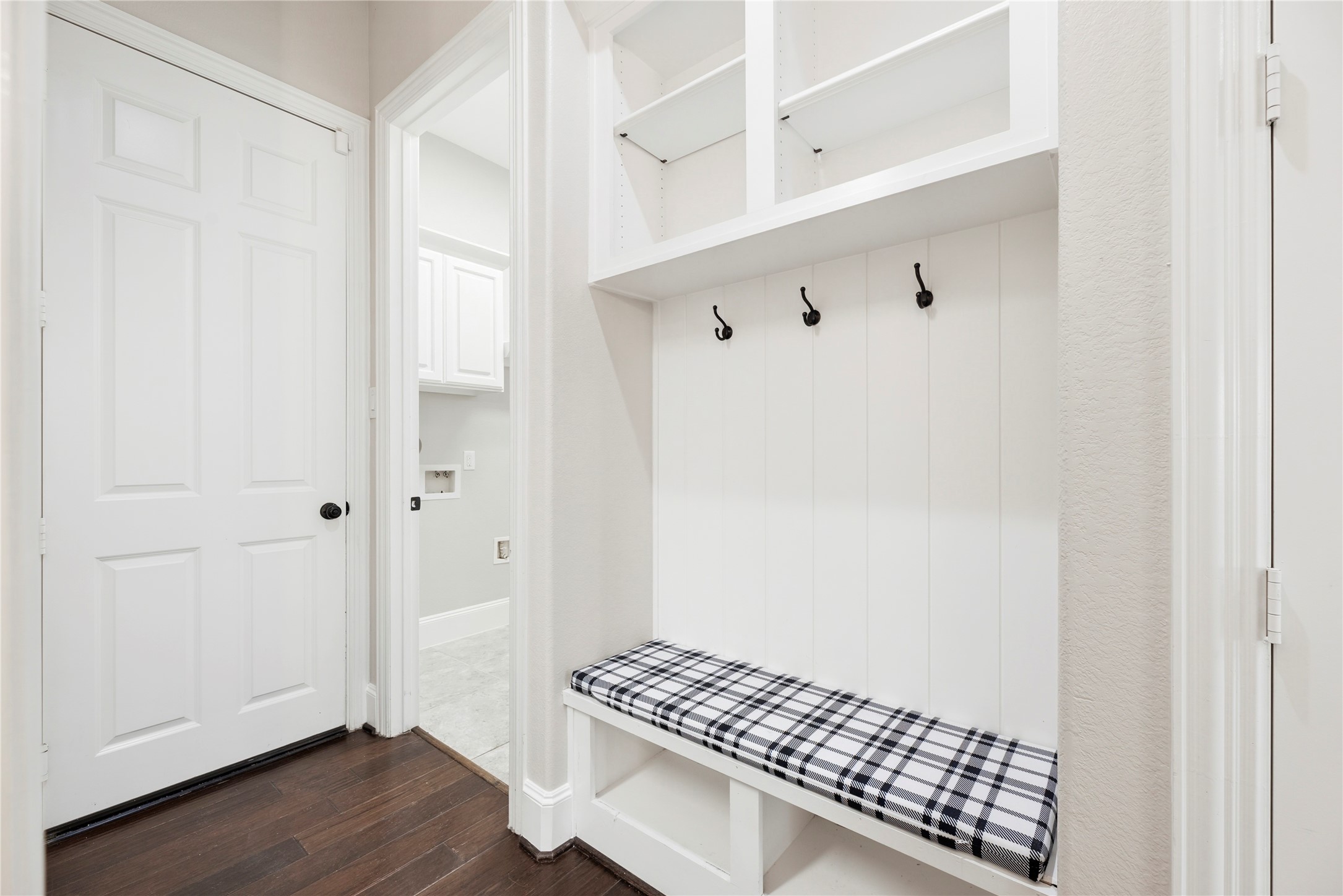 28226 South Firethorne Road Katy, TX 77494 - Photo 27 of 39 This functional mudroom features a built-in bench with a plaid cushion, cubby storage, and coat hooks to keep daily essentials perfectly organized.