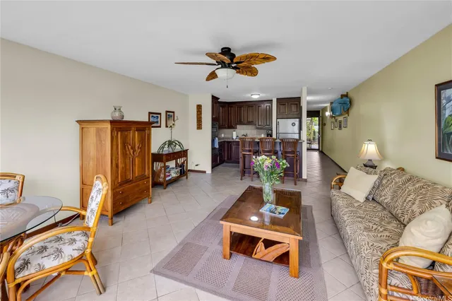 a living room with furniture a couch and a dining table