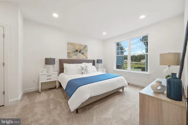 a bedroom with a bed and a table