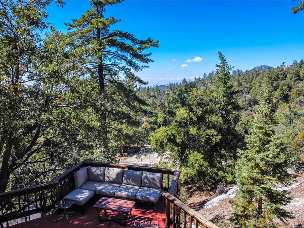 24387 Rocky Point Road Idyllwild, CA 92549 - Photo 22 of 29 a front view of a house with trees