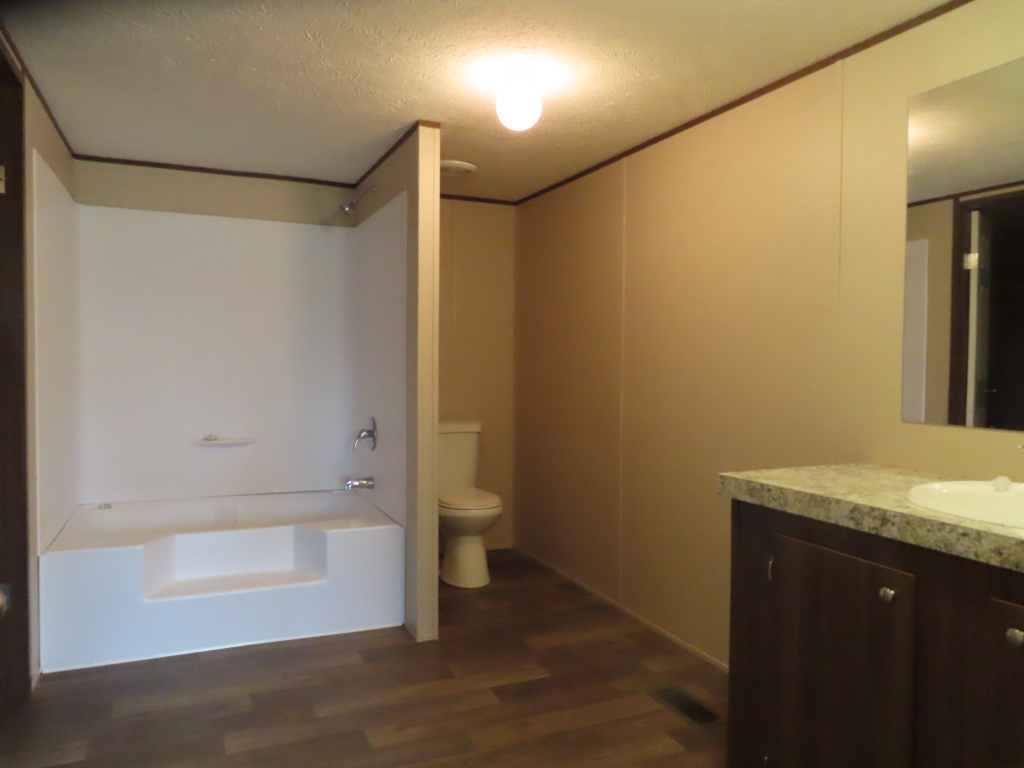 355 7th Street Tracy City, TN 37387 - Photo 18 of 21 a bathroom with a granite countertop sink and a mirror