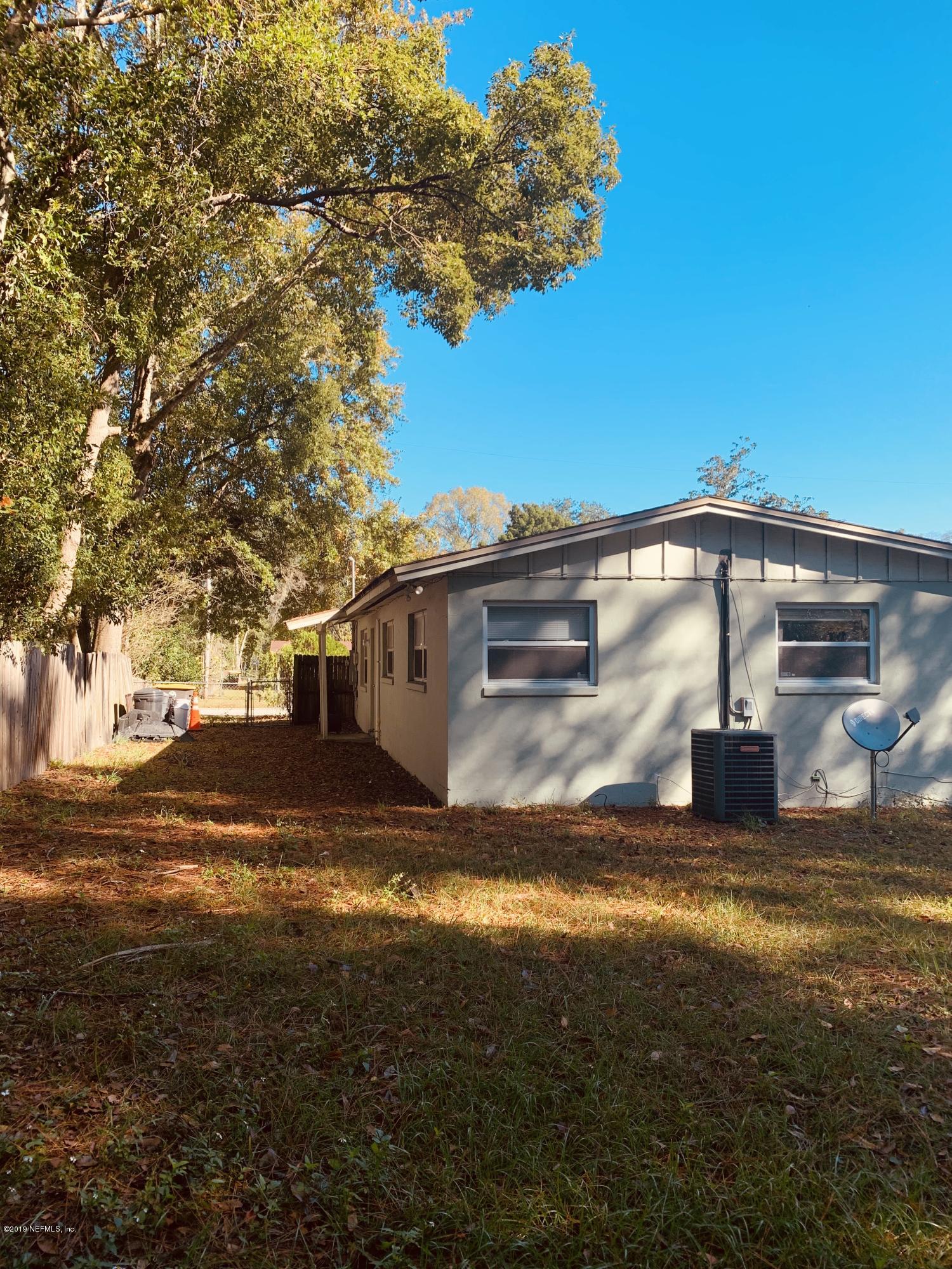 4736 Hatteras Road Jacksonville, FL 32208 - Photo 3 of 25 a view of a house with a yard