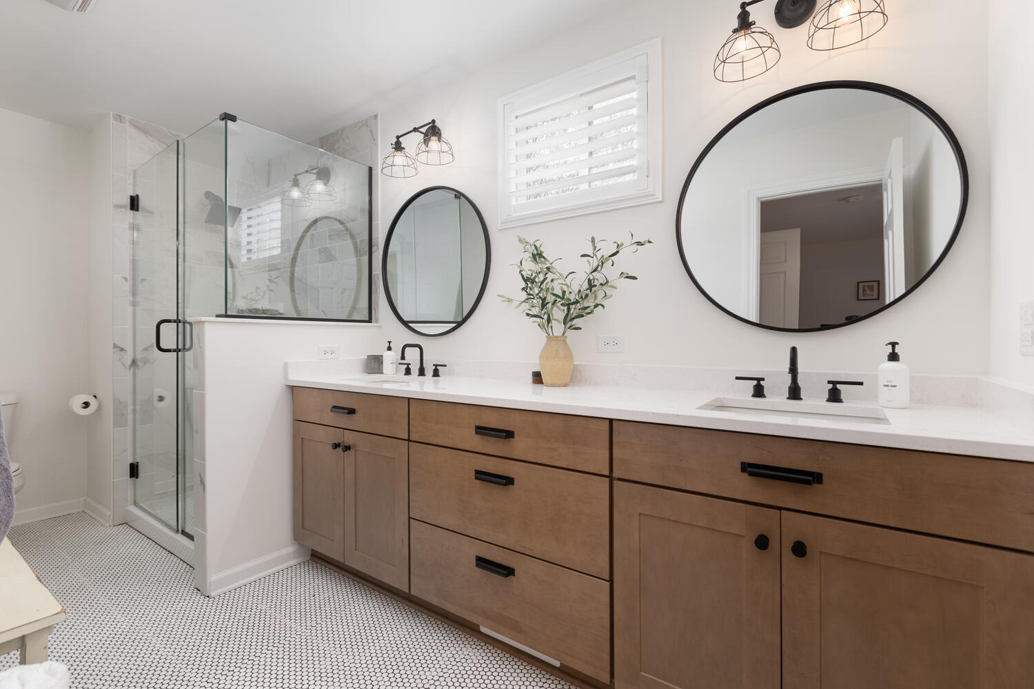 1029 Anne Road Naperville, IL 60540 - Photo 20 of 48 a bathroom with a double vanity sink and a mirror