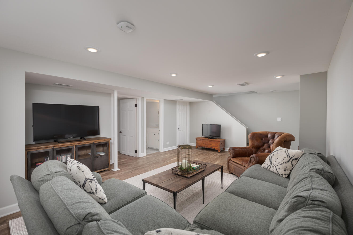 1029 Anne Road Naperville, IL 60540 - Photo 27 of 48 a living room with furniture and a flat screen tv
