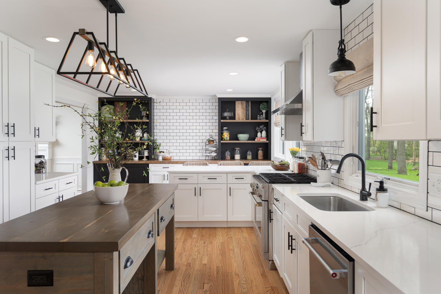 1029 Anne Road Naperville, IL 60540 - Photo 3 of 48 a kitchen with a sink dishwasher a stove a microwave oven with a dining table and chairs