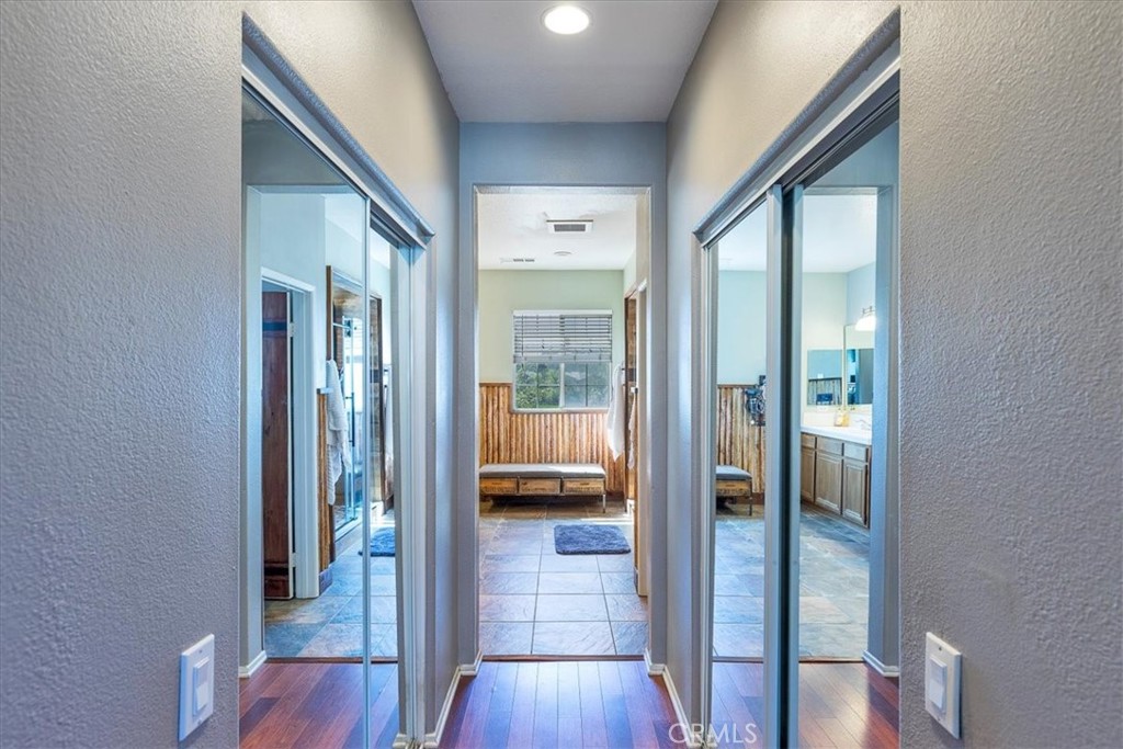 31982 Genoa Street Winchester, CA 92596 - Photo 19 of 49 Entrance into remodeled primary bath. Double closets with mirrored doors.