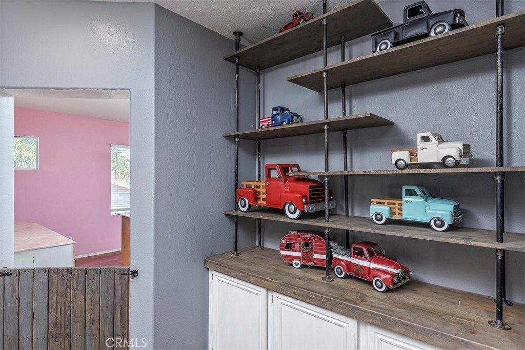 31982 Genoa Street Winchester, CA 92596 - Photo 24 of 49 Upstairs hallway storage and shelving.