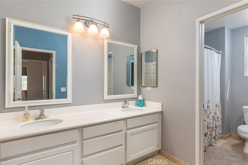 31982 Genoa Street Winchester, CA 92596 - Photo 27 of 49 Spacious upstairs bathroom with dual basins.