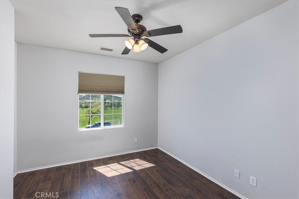31982 Genoa Street Winchester, CA 92596 - Photo 29 of 49 Downstairs bedroom. View of the park across the street.