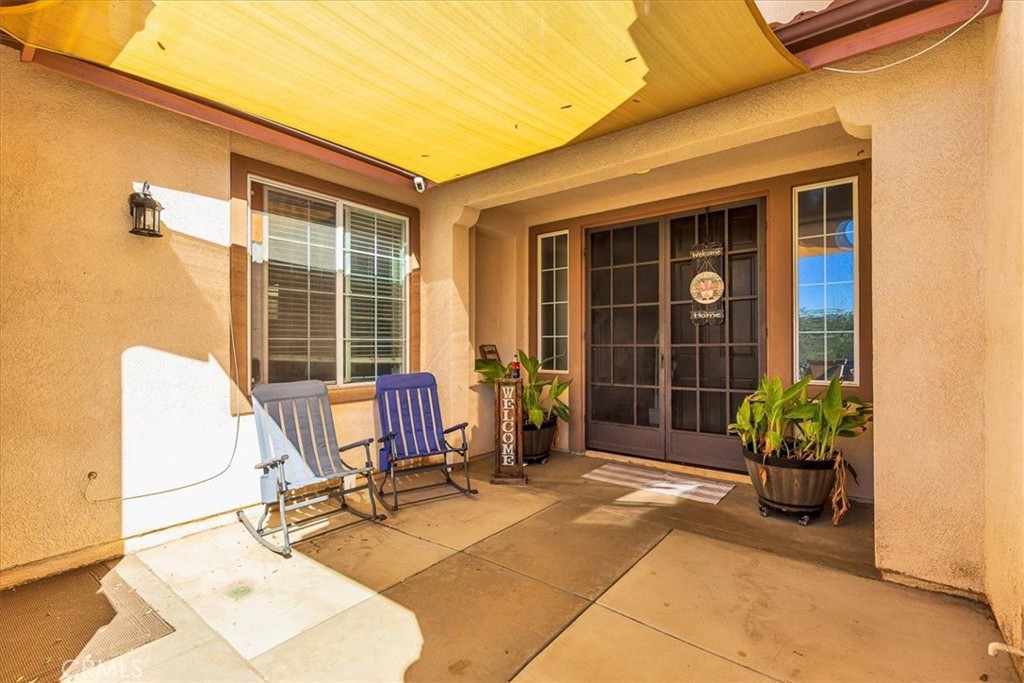 31982 Genoa Street Winchester, CA 92596 - Photo 4 of 49 Front porch with double door entry into main 3417 sq. ft. home.