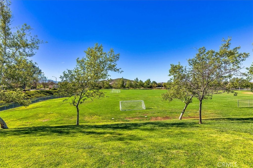 31982 Genoa Street Winchester, CA 92596 - Photo 48 of 49 Enjoy the family playing soccer on the other side of the street. Walking trails on far side of the park.