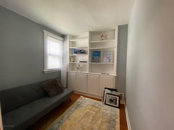 a living room with a couch and a window