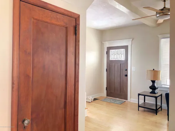 a bedroom with a bed and a table