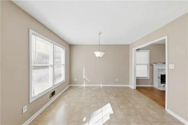 a view of a room with large windows