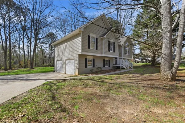 a front view of a house with a yard