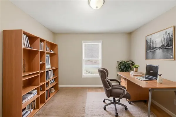 a workspace with furniture and window