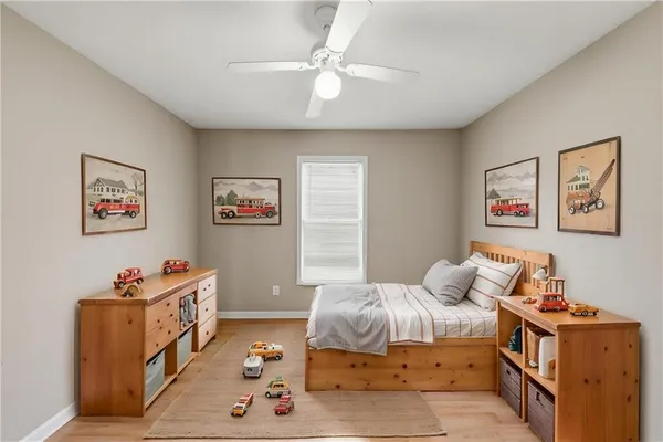 a bedroom with furniture and a chandelier