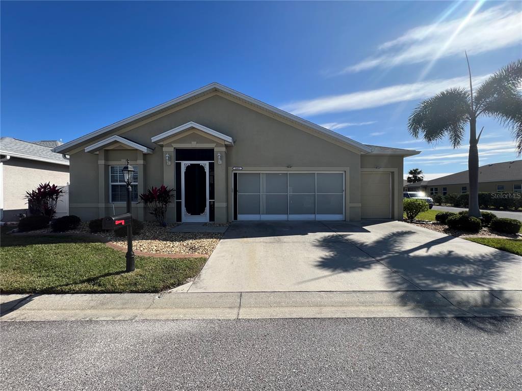 24401 Manchester Trail Port Charlotte, FL 33980 - Photo 1 of 47 a front view of a house with yard