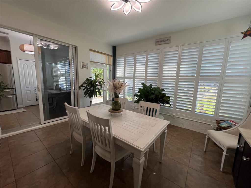 24401 Manchester Trail Port Charlotte, FL 33980 - Photo 18 of 47 a view of a dining room with furniture and window