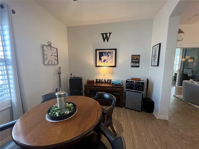 a bedroom with a bed a couch and a window