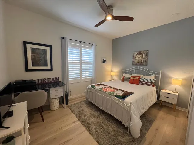 a bedroom with a bed and window