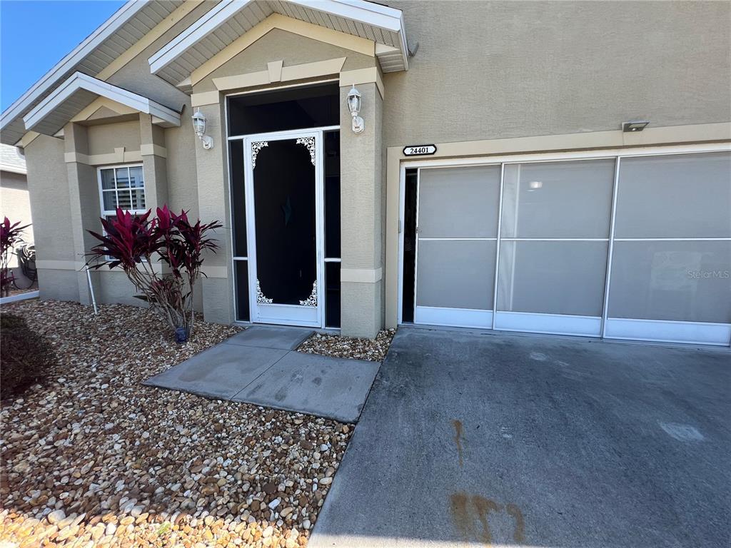 24401 Manchester Trail Port Charlotte, FL 33980 - Photo 3 of 47 front view of a house