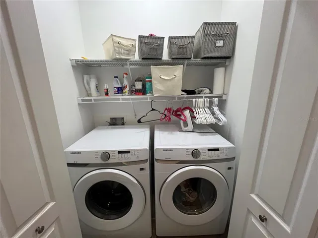 a bathroom with a sink mirror vanity and toilet