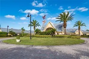 a front view of multiple houses with yard