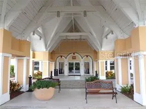 a lobby with furniture and a chandelier