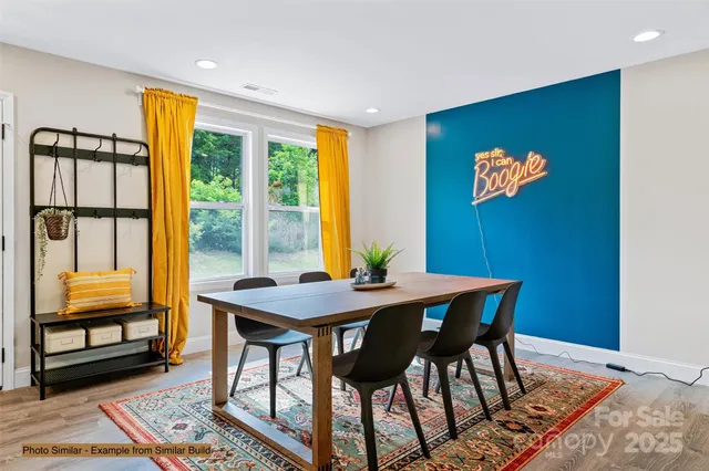 a view of a dining room with furniture and window
