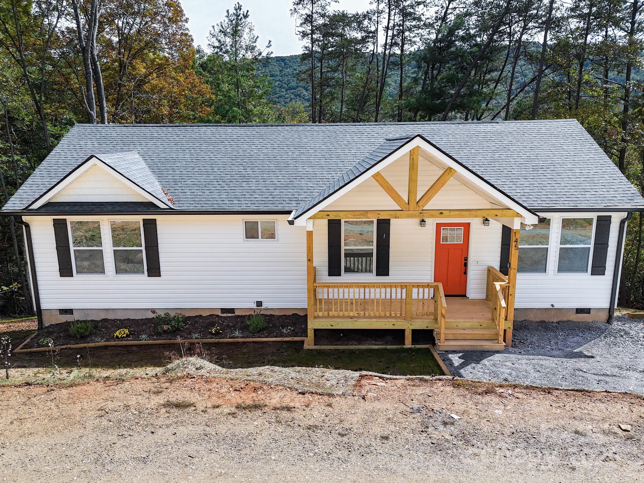 145 Burley Ridge Candler, NC 28715 - Photo 2 of 43 a view of a house with a yard