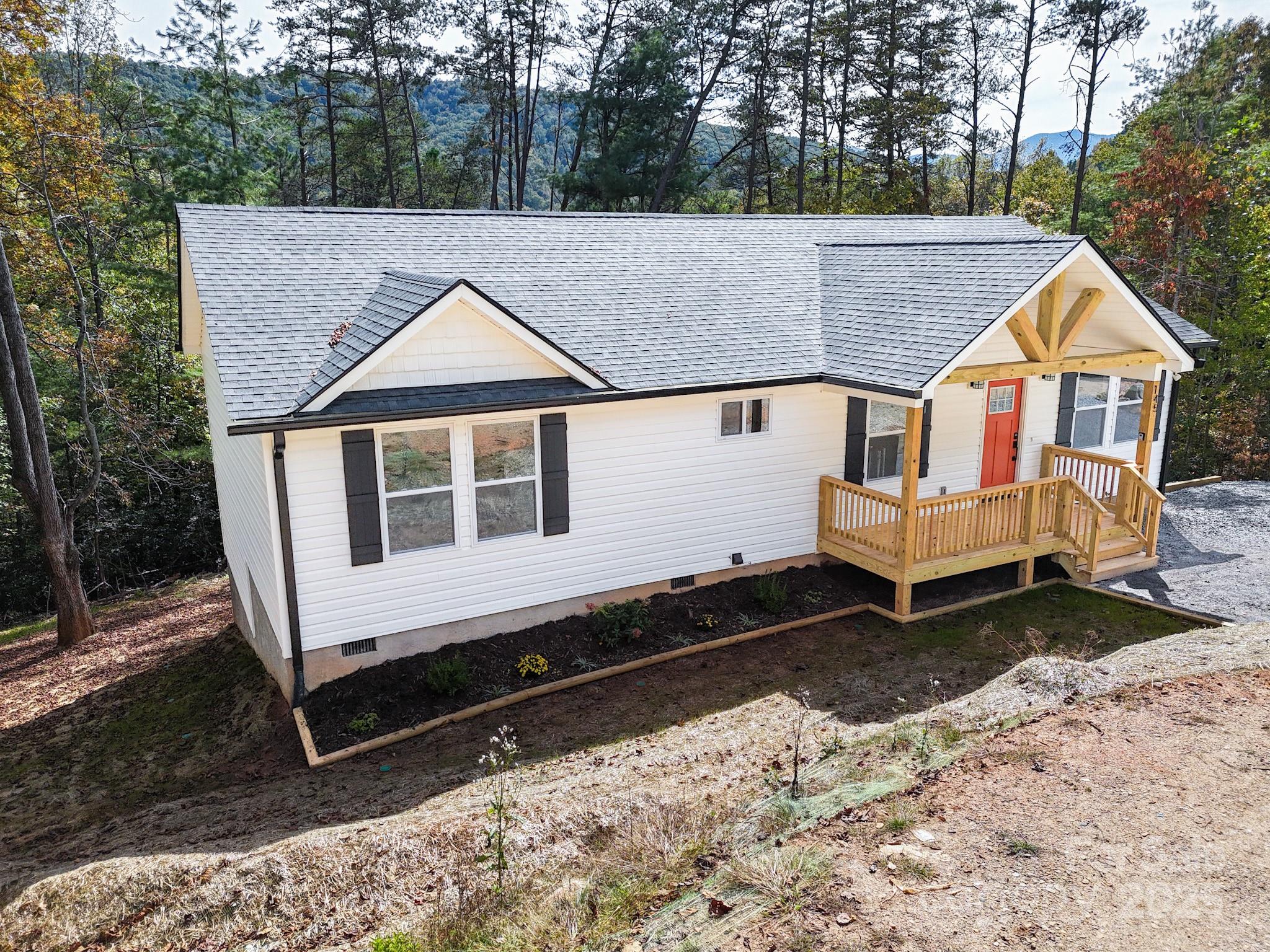 145 Burley Ridge Candler, NC 28715 - Photo 34 of 43 a view of a small house with a yard