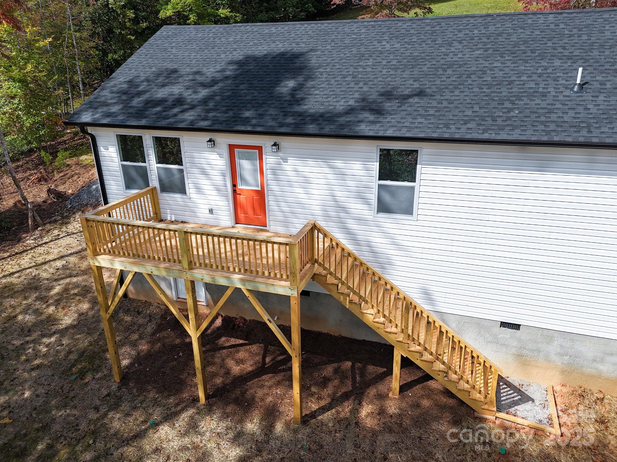 145 Burley Ridge Candler, NC 28715 - Photo 4 of 43 a roof deck with table and chairs