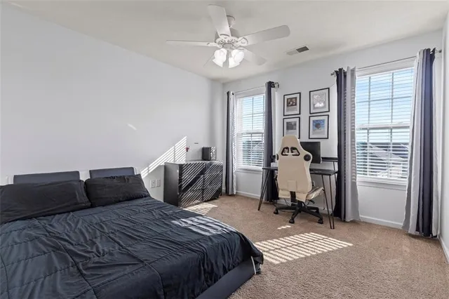 a bedroom with a bed and furniture